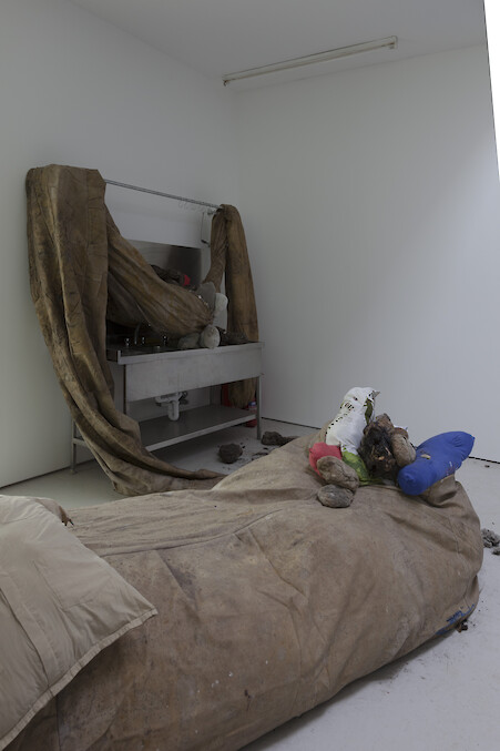 Detail View, *collective conscience*, 2015 – ongoing, Oil, latex, linen, printed canvas, velvet, coins, cotton t-shirts filled with recycled foam, corn and clay sculptures, Dimensions variable