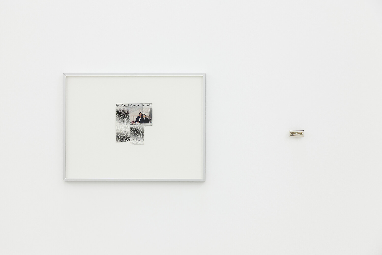 *For Now A Complex Remains*, 2018, inkjet on newsprint, matches from the World Trade Center, Framed print: 41.5 x 55 x 2.5 cm, Matchbox: 2.5 x 5.5 x 0.7 cm