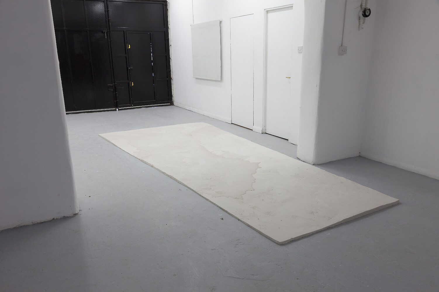 *Untitled*, 2013, Plaster, 2 x 202 x 439 cm