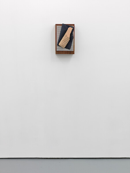 Lloyd Corporation, *Janus (As)*, 2011, Veneered MDF, perforated aluminium, office chair backing, concrete, concrete dye, 36 x 23 cm