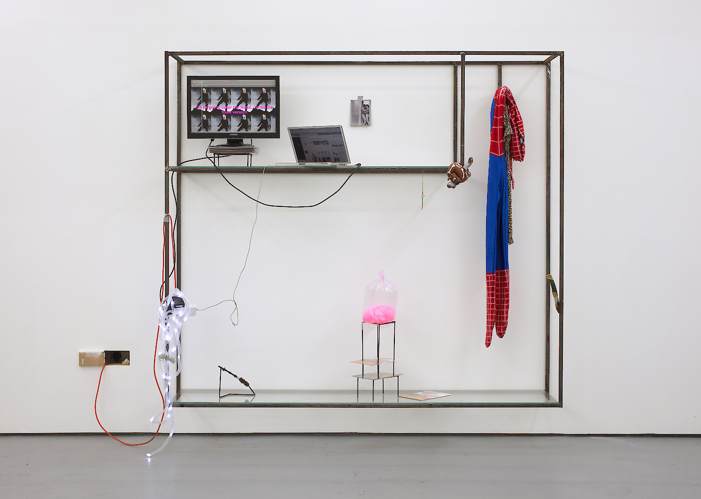 Ed Fornieles, *Adventureland*, 2011, Steel, glass, Twitter feed, computers, Spiderman costume, nylon leggings, Dorm Daze photographs, stretch Scooby-Doo, cotton candy, knife, comics, 202 x 231 x 54 cm