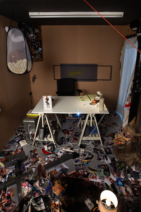 Ed Fornieles, *Dorm Daze*, 2011, Dorm Daze Facebook sitcom, Dorm Daze sitcom photographs, script book, Magic Johnson poster, red NYC cap, sports socks, steel pentagram, glass, silk jersey, computer, projector, popcorn, basketball, pinboard, jacket, voodoo doll